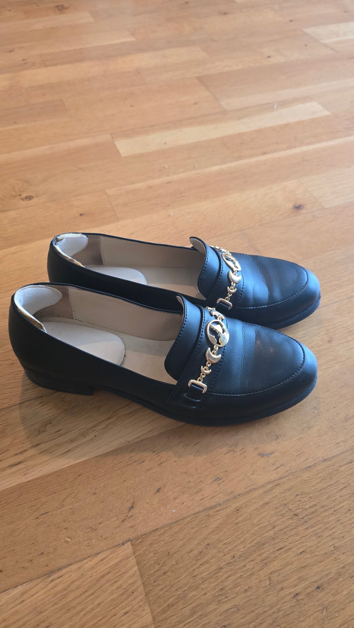 Mocassins noirs Symbole doré