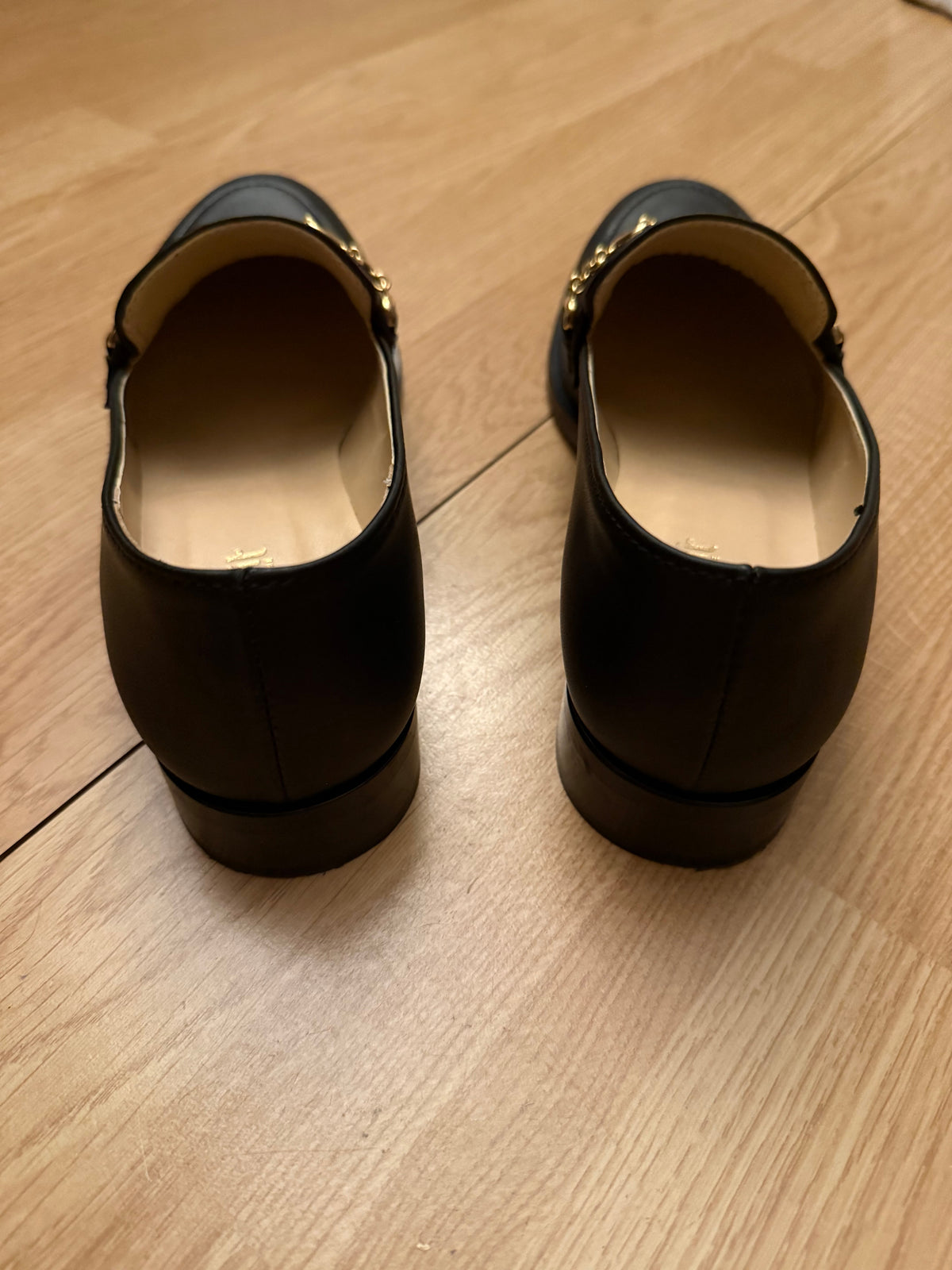 Mocassins noir symbole doré